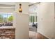 Bright hallway view, leading to a sunlit seating area with outdoor views at 33317 N 71St St, Scottsdale, AZ 85266