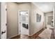 Inviting hallway with wood floors offering a view of the cozy bedroom at 33317 N 71St St, Scottsdale, AZ 85266