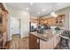 Spacious kitchen island with granite countertop and natural wood cabinets at 33317 N 71St St, Scottsdale, AZ 85266