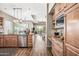 Open kitchen flows into the living room with stainless appliances and an island at 33317 N 71St St, Scottsdale, AZ 85266