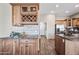 Gourmet kitchen with wine storage, granite countertops, and stainless steel appliances at 33317 N 71St St, Scottsdale, AZ 85266