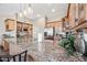 Kitchen island with granite countertops, stainless steel appliances, and wooden cabinets at 33317 N 71St St, Scottsdale, AZ 85266