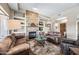 Comfortable living room with a stone fireplace, and stylish decor at 33317 N 71St St, Scottsdale, AZ 85266