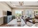 Living area with a seamless flow to the outdoors with neutral tones and wood accents at 33317 N 71St St, Scottsdale, AZ 85266