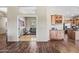Open-concept living area with beautiful hardwood floors and a convenient wet bar at 33317 N 71St St, Scottsdale, AZ 85266