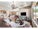 Comfortable living room features an open layout with seamless flow to the kitchen at 33317 N 71St St, Scottsdale, AZ 85266
