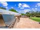 An outdoor kitchen area with a built-in grill and a seating area with a fireplace at 33317 N 71St St, Scottsdale, AZ 85266