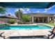 Beautiful backyard featuring a sparkling pool with views of the home and surrounding desert landscape at 33317 N 71St St, Scottsdale, AZ 85266