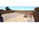 Backyard features a fire pit, gravel area, mountain views at 42382 W Hillman Dr, Maricopa, AZ 85138