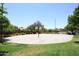 Outdoor basketball court surrounded by green space, offering a great recreational amenity for residents and families at 42382 W Hillman Dr, Maricopa, AZ 85138