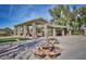 Covered picnic tables and shaded seating areas, perfect for community gatherings and enjoying outdoor meals in a park setting at 42382 W Hillman Dr, Maricopa, AZ 85138