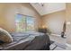 Bedroom featuring a large window providing natural light with a neutral interior at 4601 N 102Nd Ave # 1055, Phoenix, AZ 85037