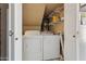 Laundry room including full-size washing machine and dryer in closet space at 4601 N 102Nd Ave # 1055, Phoenix, AZ 85037