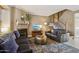 Cozy living room featuring a fireplace, plush sofas, and a decorative rug at 4601 N 102Nd Ave # 1055, Phoenix, AZ 85037