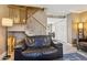 Spacious living area with staircase, comfortable seating, and modern decor at 4601 N 102Nd Ave # 1055, Phoenix, AZ 85037