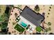 Stunning aerial view of private backyard oasis featuring pool, lounge area, putting green, and desert landscaping at 4633 N 49Th Pl, Phoenix, AZ 85018