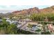 Stunning aerial view of a modern home with a pool and manicured backyard against a backdrop of desert mountains at 4633 N 49Th Pl, Phoenix, AZ 85018