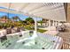 Spacious outdoor patio with pergola, hot tub, lounge chairs, and beautiful backyard views at 4633 N 49Th Pl, Phoenix, AZ 85018