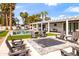 Luxurious backyard with pool, lounge chairs, fire pit, and outdoor living space at 4633 N 49Th Pl, Phoenix, AZ 85018