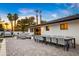 Spacious backyard patio with dining area, lounge seating, outdoor kitchen, and access to the pool at 4633 N 49Th Pl, Phoenix, AZ 85018