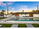 Beautiful backyard with a large pool, outdoor kitchen, lounge seating, and dining area, perfect for entertaining at 4633 N 49Th Pl, Phoenix, AZ 85018