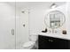 Elegant bathroom with a glass-enclosed shower, updated fixtures, and a stylish vanity with marble countertop at 4633 N 49Th Pl, Phoenix, AZ 85018