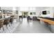 Open-concept living room boasts modern gray accents, stylish lighting, and indoor recreation area at 4633 N 49Th Pl, Phoenix, AZ 85018
