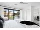 Comfortable main bedroom with a view of the pool and backyard, featuring a walk-in closet at 4633 N 49Th Pl, Phoenix, AZ 85018