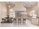 Bright kitchen featuring an island with bar seating, a breakfast nook, and stainless steel appliances at 5517 W Aster Dr, Glendale, AZ 85304