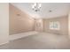 Open-concept living room with high ceilings and ample natural light at 5517 W Aster Dr, Glendale, AZ 85304