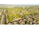 Expansive aerial view of golf course, parks, community, neighborhood, surrounding landscaping, and majestic mountain backdrop at 6435 E Monte Cristo Ave, Scottsdale, AZ 85254