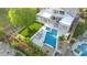 Aerial view of a backyard featuring a pool, jacuzzi, patio, and well-maintained lawn with mature landscaping at 6435 E Monte Cristo Ave, Scottsdale, AZ 85254