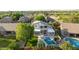 Aerial view of a luxury home with a sparkling pool, lush landscaping, and a covered patio, perfect for outdoor living at 6435 E Monte Cristo Ave, Scottsdale, AZ 85254