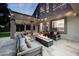 Backyard view featuring a firepit and lounge area, covered patio, and string lights for a relaxing atmosphere at 6435 E Monte Cristo Ave, Scottsdale, AZ 85254