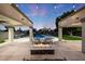 Beautiful outdoor living space featuring a fire pit, patio seating, and a well-maintained pool at 6435 E Monte Cristo Ave, Scottsdale, AZ 85254