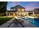Gorgeous backyard with a sparkling pool and spa and covered patio seating for outdoor relaxation at 6435 E Monte Cristo Ave, Scottsdale, AZ 85254