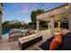 Cozy outdoor living space featuring a modern fire pit, comfortable seating, and stylish string lights at 6435 E Monte Cristo Ave, Scottsdale, AZ 85254