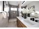 Updated bathroom with dual sinks, modern fixtures, and a tiled shower/tub combination at 6435 E Monte Cristo Ave, Scottsdale, AZ 85254