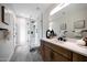 Modern bathroom featuring a vanity with a white countertop and a glass enclosed shower at 6435 E Monte Cristo Ave, Scottsdale, AZ 85254