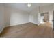 Empty bedroom featuring hardwood floors, vaulted ceiling, neutral paint, and closet space at 6435 E Monte Cristo Ave, Scottsdale, AZ 85254