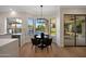Cozy dining area with backyard views, modern lighting, and easy access to the kitchen and outdoor spaces at 6435 E Monte Cristo Ave, Scottsdale, AZ 85254