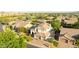 Aerial view of home with a three car garage, mature landscaping, backyard pool, neutral color palette, and tile roof at 6435 E Monte Cristo Ave, Scottsdale, AZ 85254