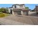 A luxurious home featuring a three-car garage and well-manicured landscaping at 6435 E Monte Cristo Ave, Scottsdale, AZ 85254