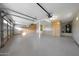 Well-lit garage offers plenty of space and storage, with custom cabinets and epoxy flooring at 6435 E Monte Cristo Ave, Scottsdale, AZ 85254