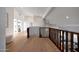 Second floor hallway has wooden floors, neutral walls, and access to other rooms of the home at 6435 E Monte Cristo Ave, Scottsdale, AZ 85254
