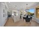 Bright kitchen featuring white cabinets, stainless steel appliances, hardwood floors, and eat in kitchen nook at 6435 E Monte Cristo Ave, Scottsdale, AZ 85254