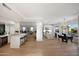 A modern kitchen with hardwood floors, stainless steel appliances, granite countertops and large island at 6435 E Monte Cristo Ave, Scottsdale, AZ 85254