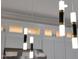 Stylish pendant lights illuminate this kitchen at 6435 E Monte Cristo Ave, Scottsdale, AZ 85254