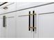 Modern kitchen cabinets are adorned with elegant black and gold pulls at 6435 E Monte Cristo Ave, Scottsdale, AZ 85254