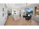 Modern kitchen featuring stainless steel appliances, eat-in area, large island, modern lighting, and backyard views at 6435 E Monte Cristo Ave, Scottsdale, AZ 85254